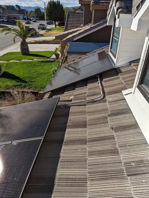 Solar panel mounting detail on a tile roof in Palmdale, CA