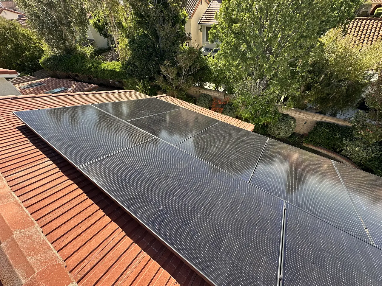 Nine Aptos 460 watt panels on a tile roof in Porter Ranch