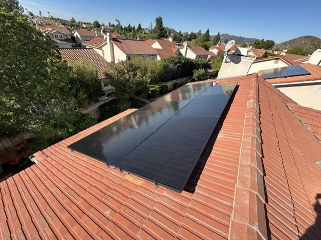Solar panel mounting detail on a tile roof in Porter Ranch, CA