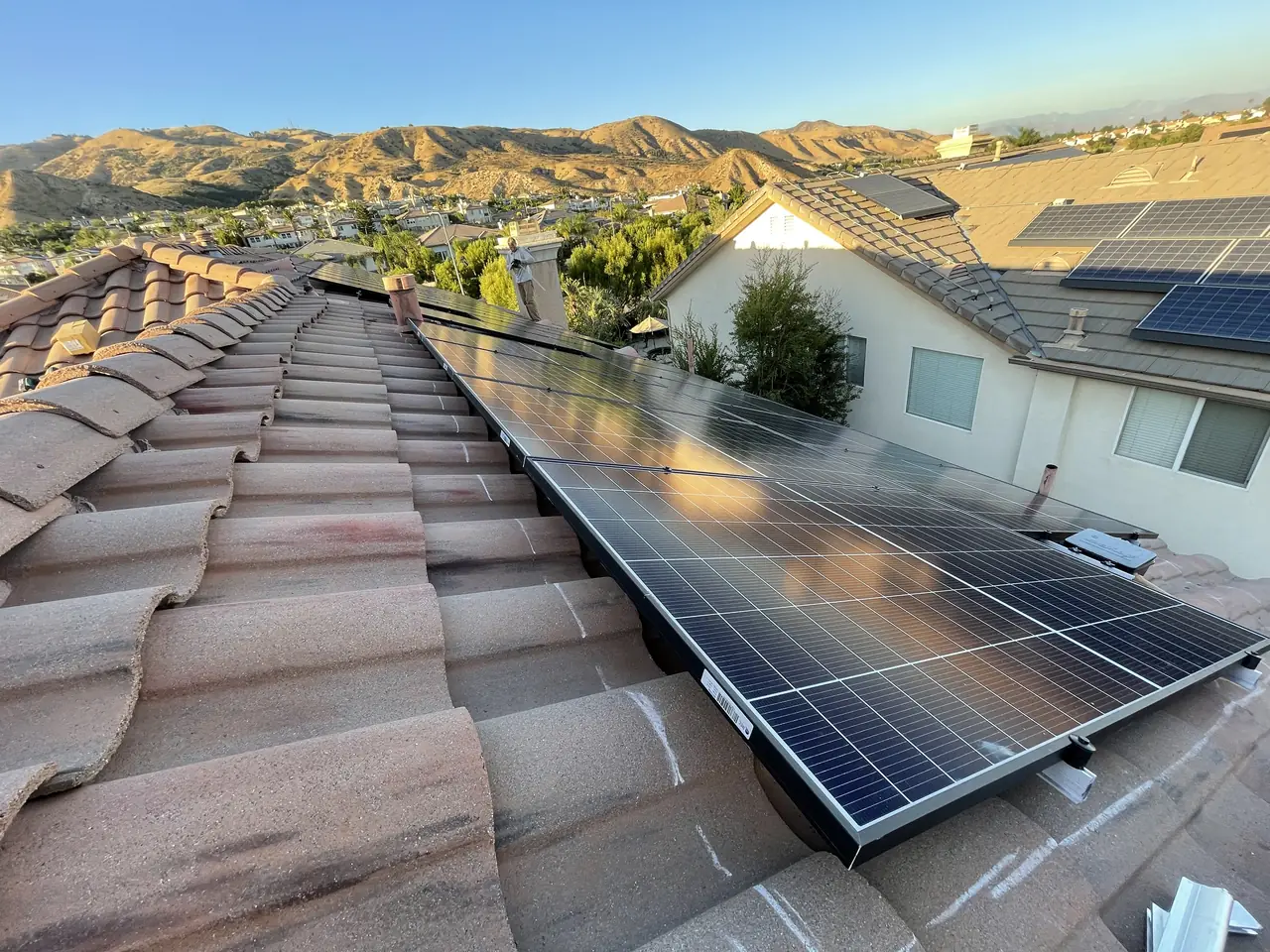 Solar modules along a tile roof seen from the ridge, Porter Ranch