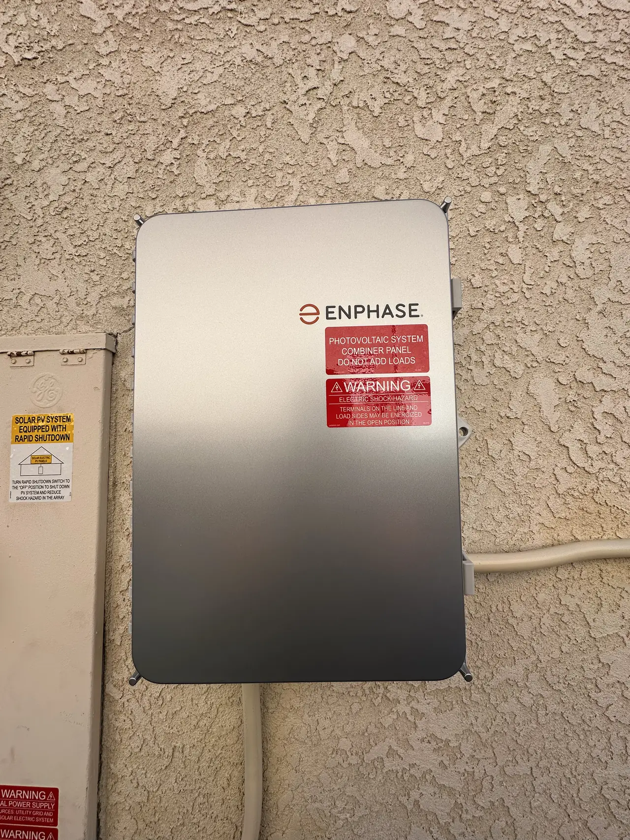 A closed combiner enclosure on a stucco wall, Porter Ranch