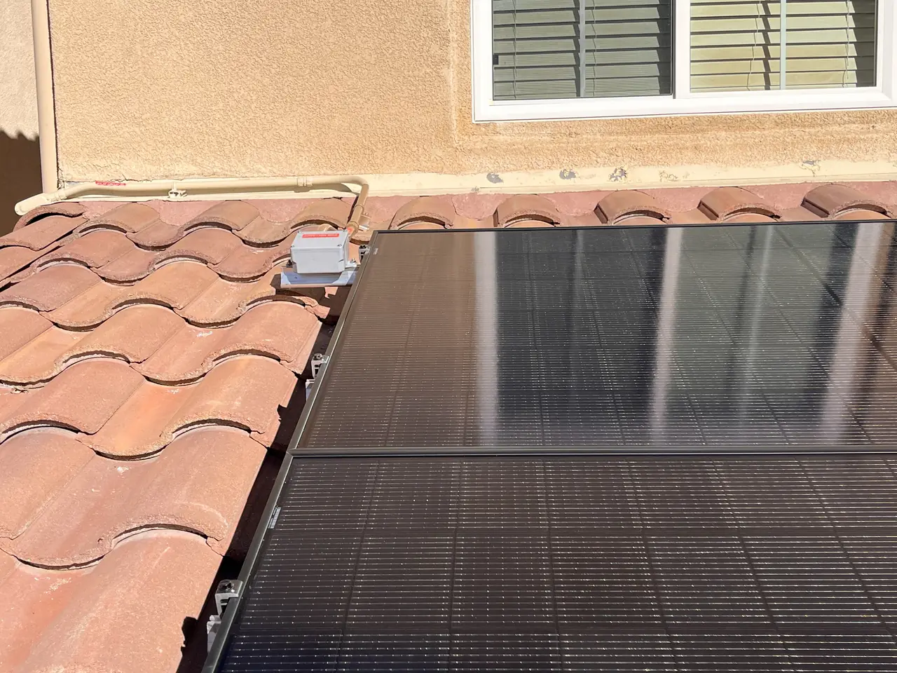 The edge of a solar array where the modules meet the tile, Porter Ranch
