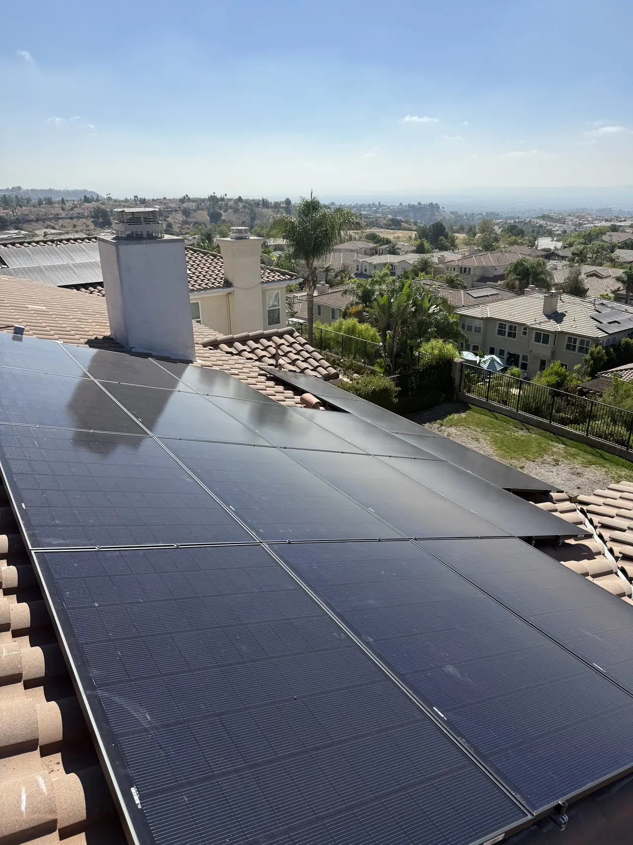 A solar array seen from above on a tile roof, Porter Ranch