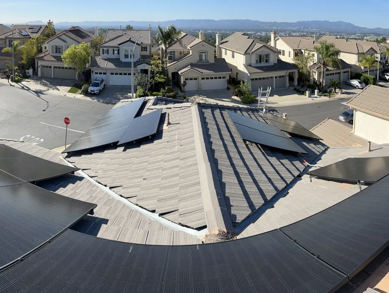 A tile roof carrying solar modules across several planes, Porter Ranch