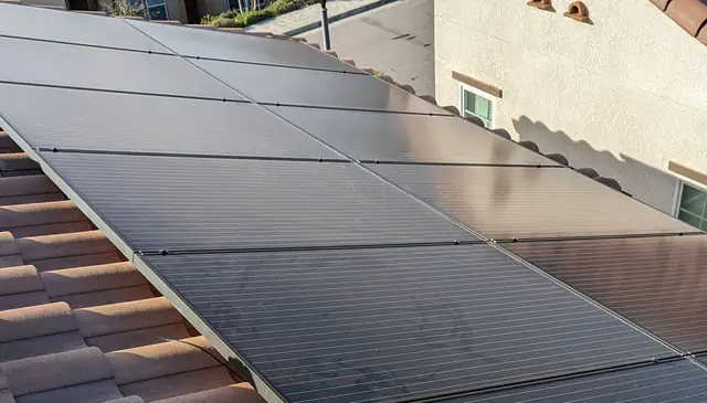 A solar array along a tile roof in a gated tract, Porter Ranch