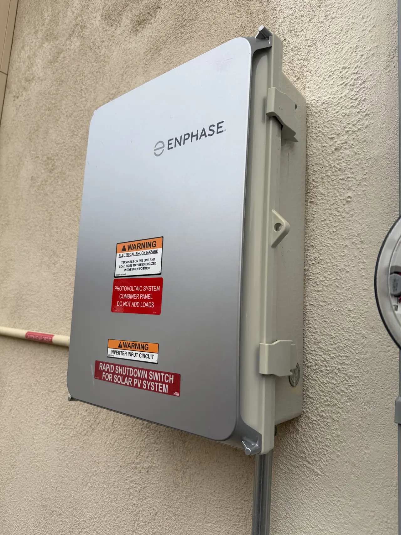 A closed combiner enclosure on a stucco wall, Porter Ranch
