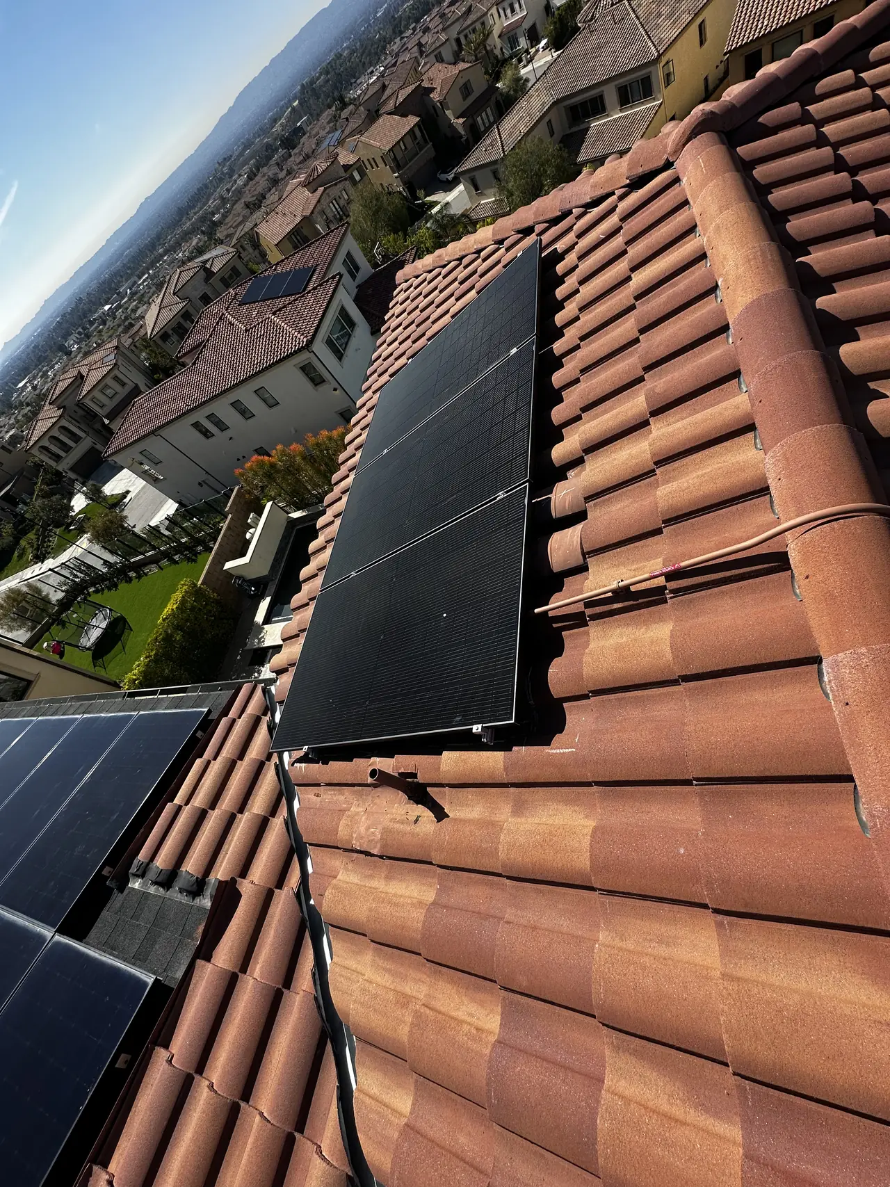 Solar modules along a tile roof slope, Porter Ranch