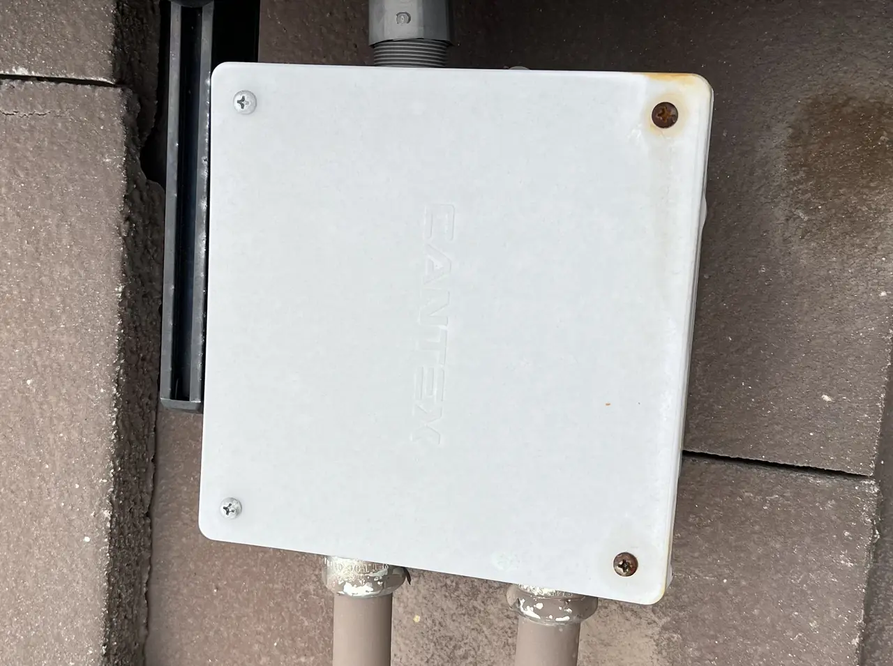 A closed junction enclosure on a shingle roof beside the modules, Porter Ranch
