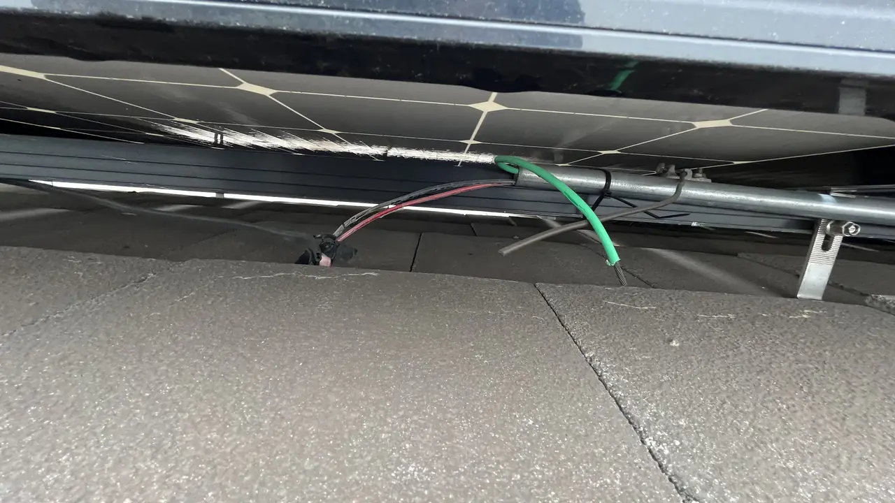 Cable connectors running under the edge of a solar module, Porter Ranch