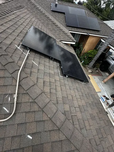 Solar panel mounting detail on a composition shingle roof in Reseda, CA