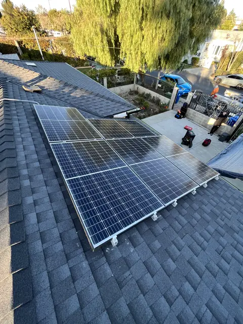 Solar panel mounting detail on a composition shingle roof in Reseda, CA