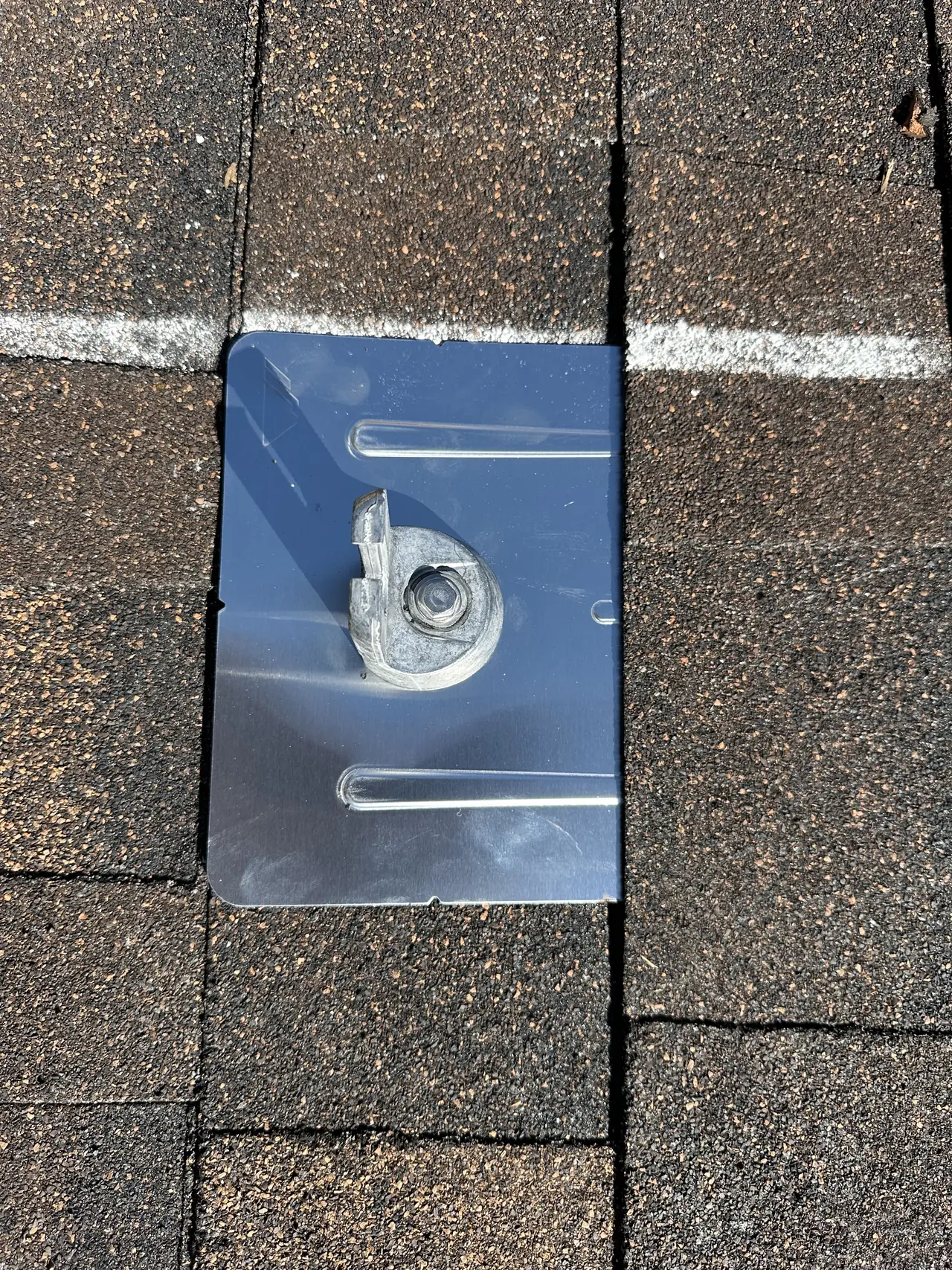 Flashed metal attachment lapped into the courses of the new asphalt shingle, Reseda