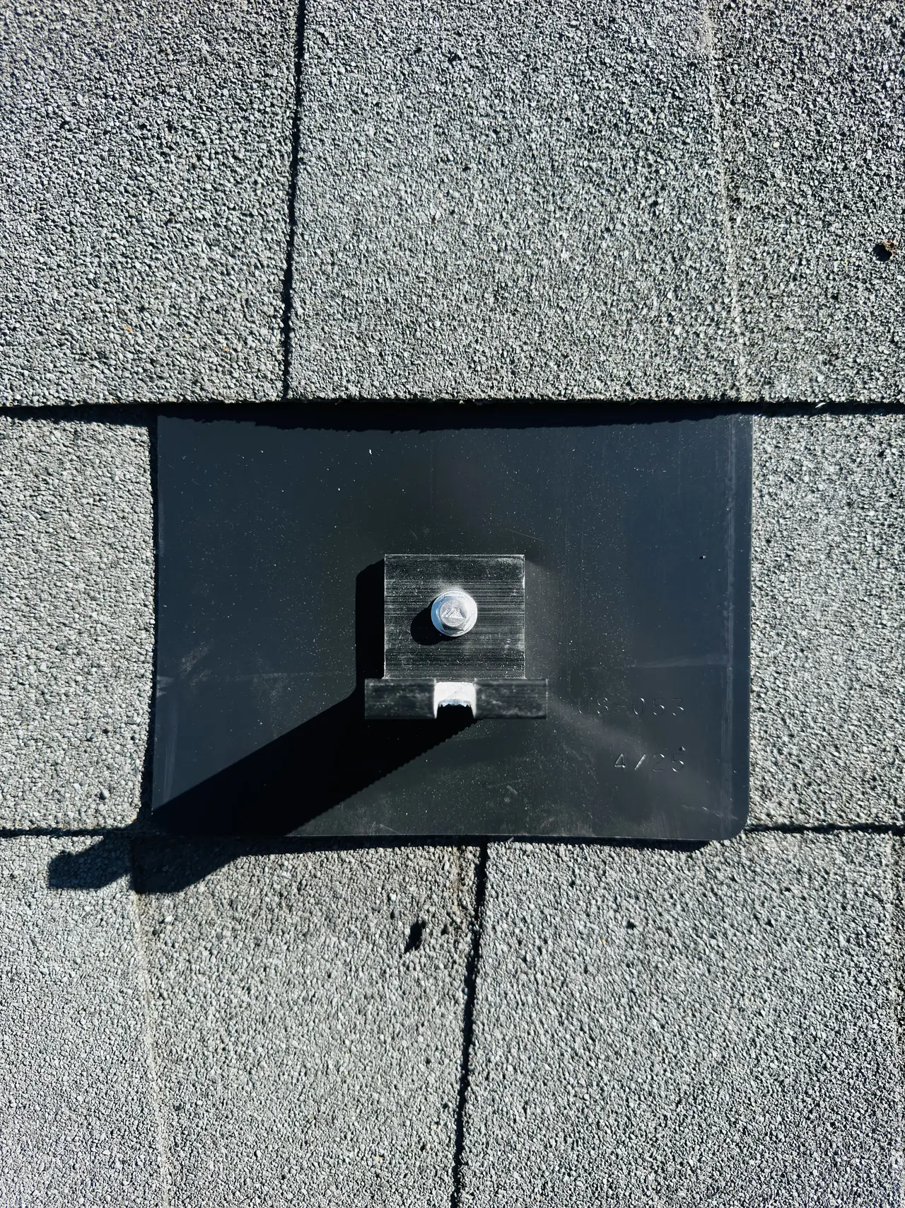 Flashed metal attachment lapped into the shingle courses on the new roof, Reseda