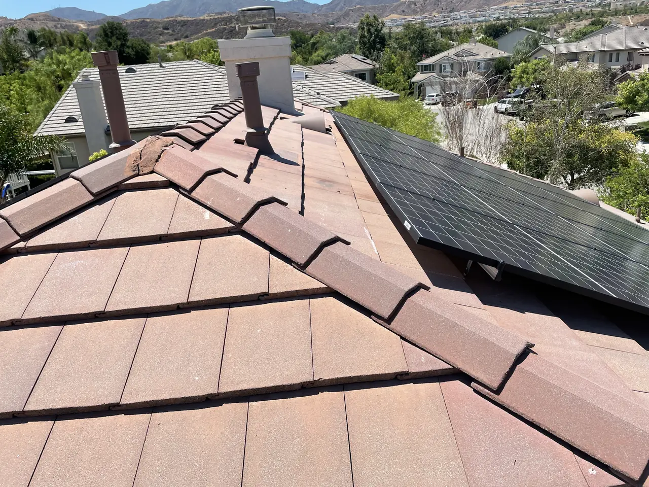 Solar panel mounting detail on a tile roof in Santa Clarita, CA