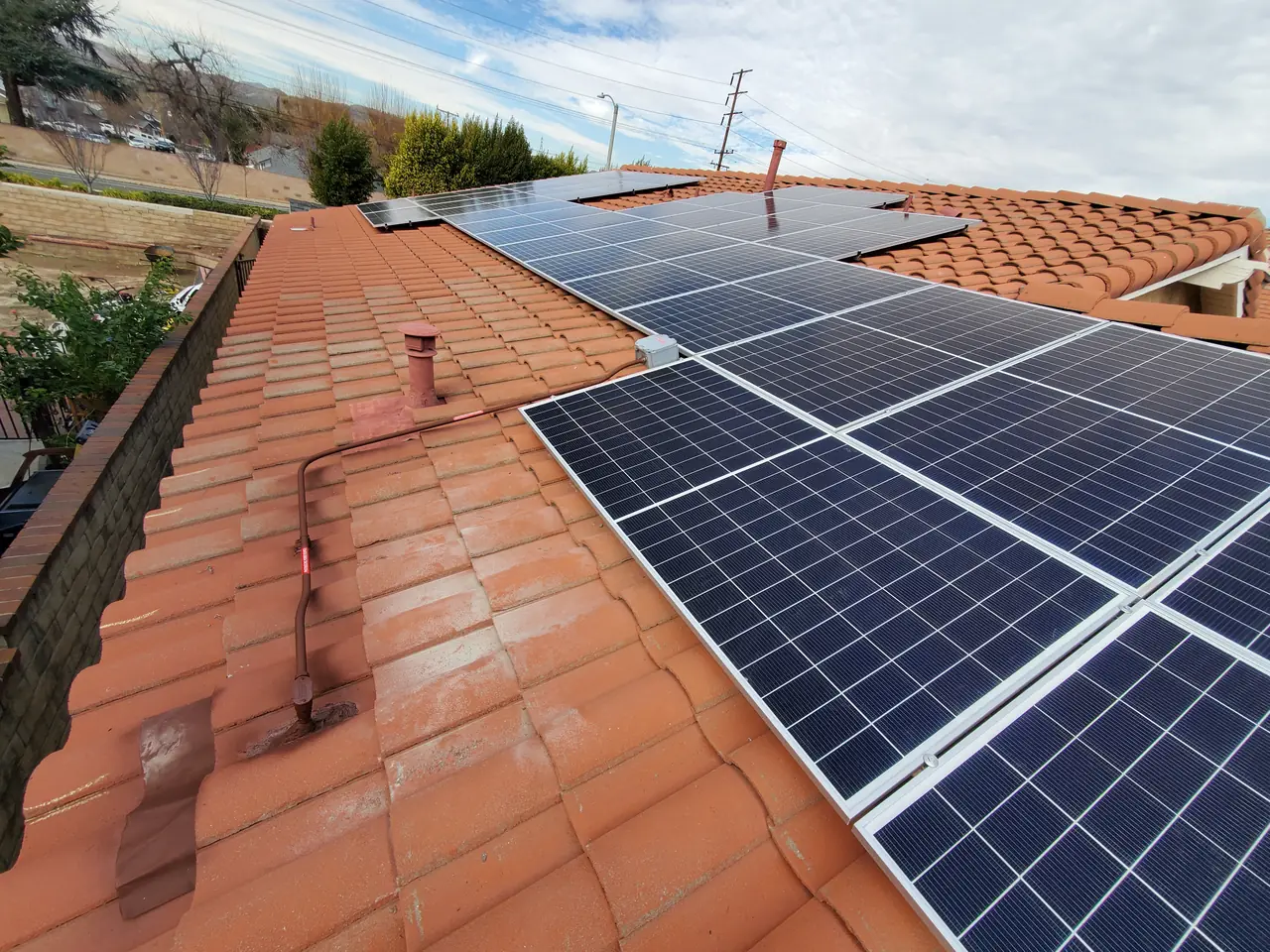 Solar panel mounting detail on a tile roof in Santa Clarita, CA