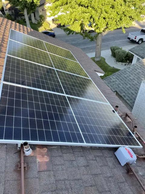 Solar panel mounting detail on a composition shingle roof in Santa Clarita, CA