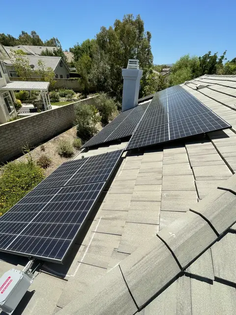 Solar panel mounting detail on a composition shingle roof in Santa Clarita, CA