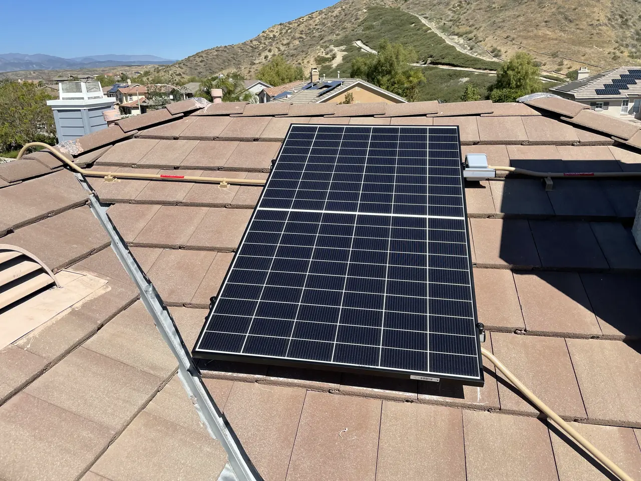 A tile roof seen from the ridge with the array set in a single rectangle, Santa Clarita