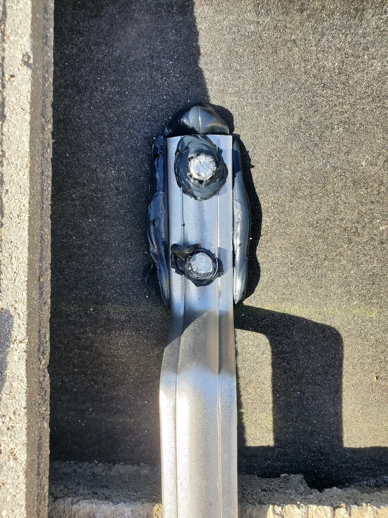 A roof mount sealed with flashing compound between tiles, Santa Clarita