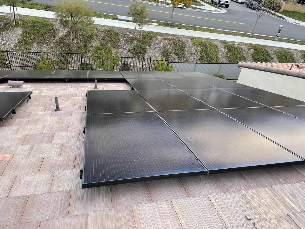 Solar modules along a roof slope above a hillside street, Santa Clarita