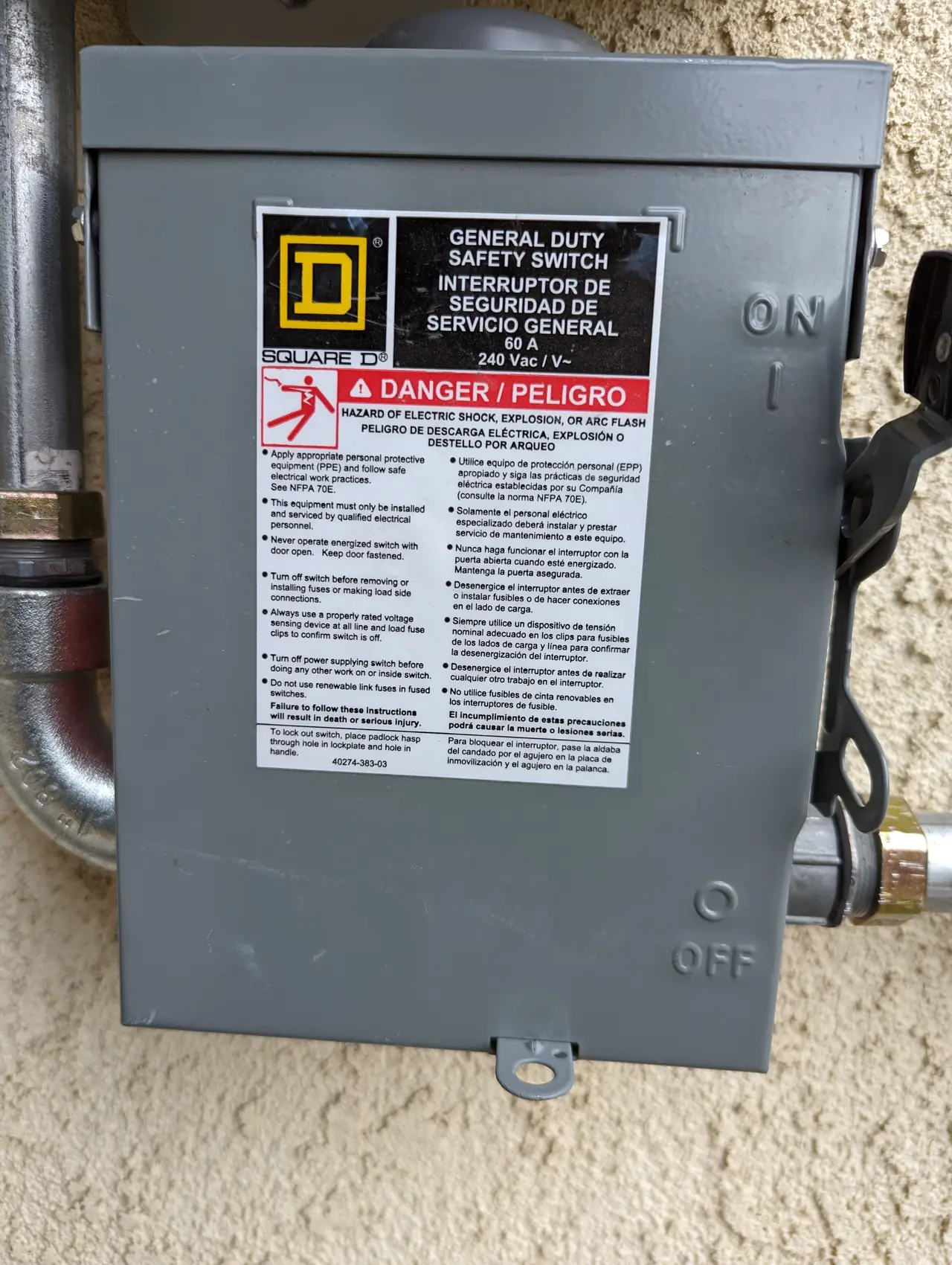 A closed 60 A general-duty safety switch on a stucco wall, Santa Clarita
