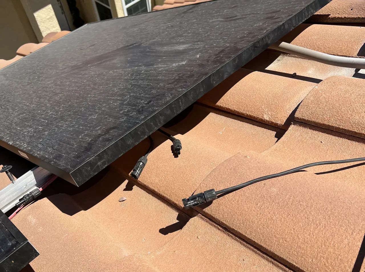 Solar modules stepped across a clay tile roof, Santa Clarita