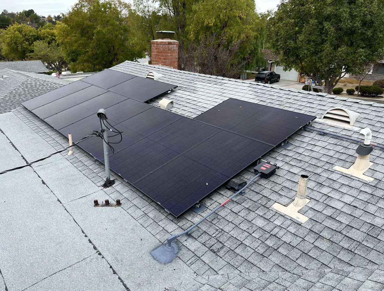 Solar modules across two slopes of a shingle roof, Santa Clarita