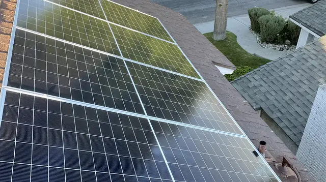 A solar array on a shingle roof above the street, Santa Clarita