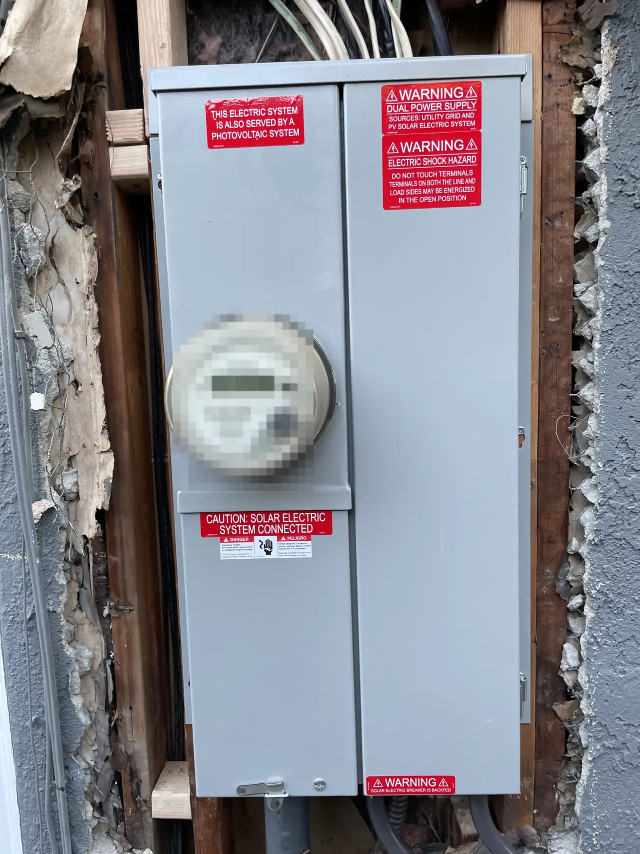 A new service panel set into an opened section of stucco wall, Santa Clarita