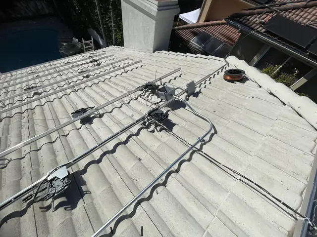 Solar panel mounting detail on a tile roof in Sherman Oaks, CA