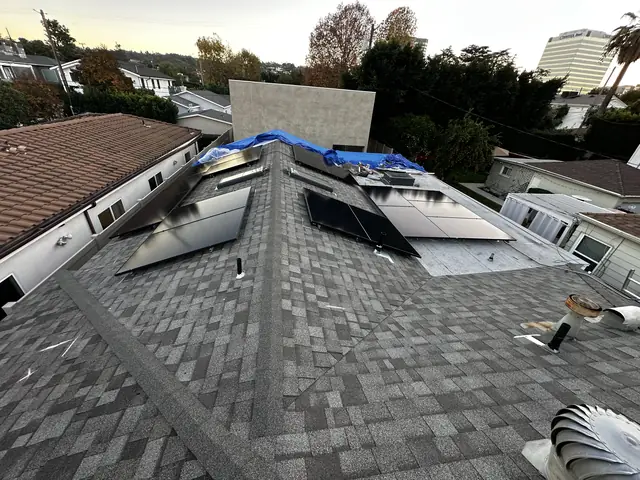 Solar panel mounting detail on a composition shingle roof in Sherman Oaks, CA