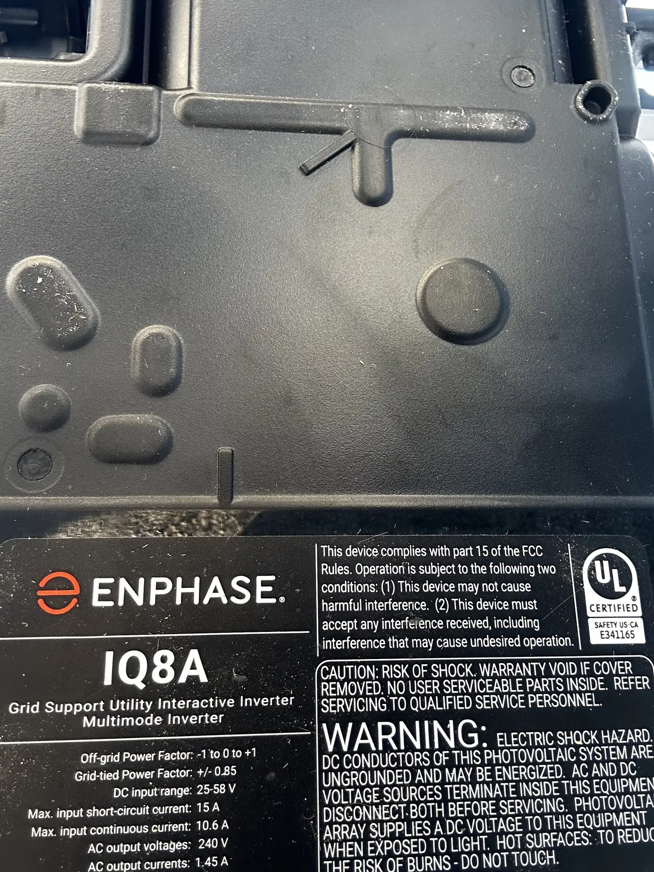 Enphase IQ8A microinverter showing its label, Sherman Oaks