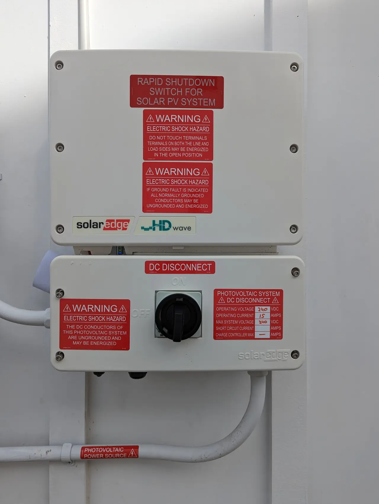 SolarEdge HD-Wave inverter and DC disconnect mounted on an exterior wall, Sherman Oaks
