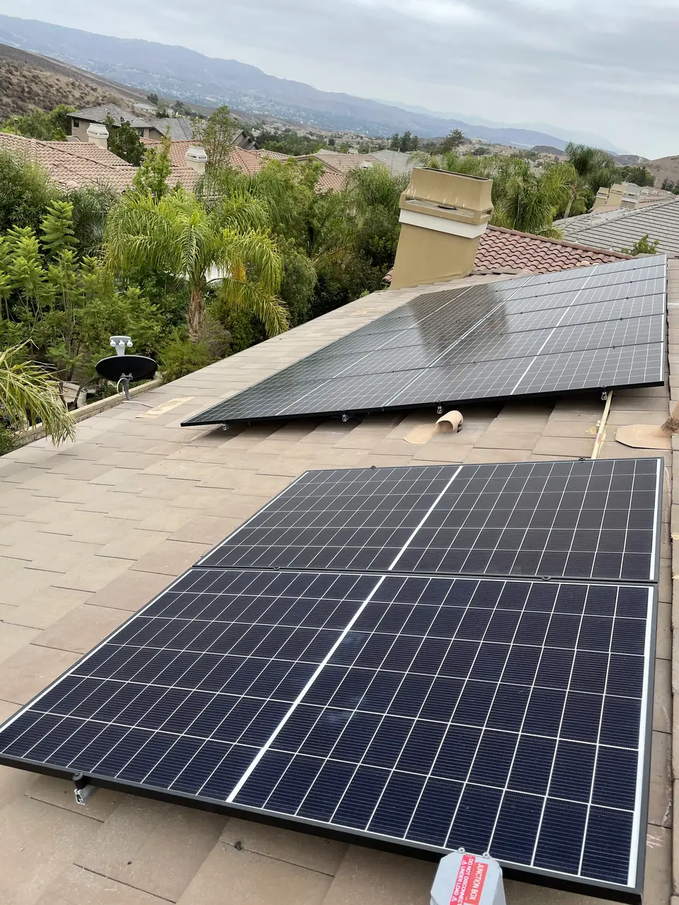 Solar panel mounting detail on a tile roof in Simi Valley, CA
