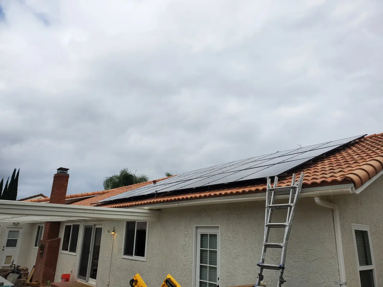 REC panels with Enphase microinverters on a barrel-tile roof in Simi Valley