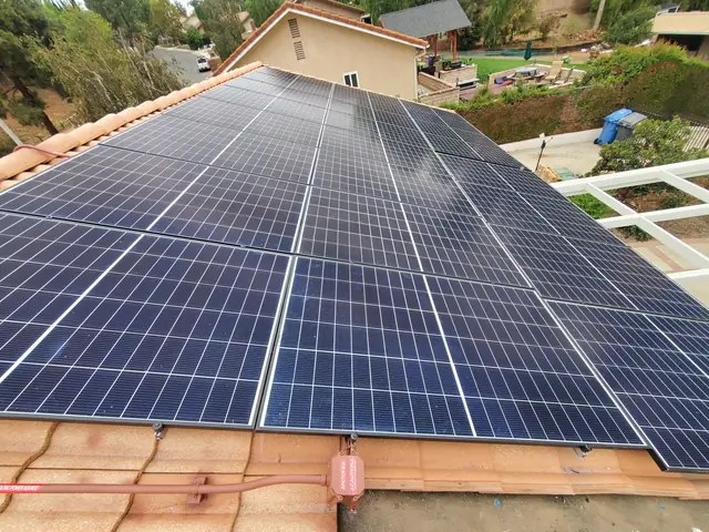 Solar panel mounting detail on a tile roof in Simi Valley, CA