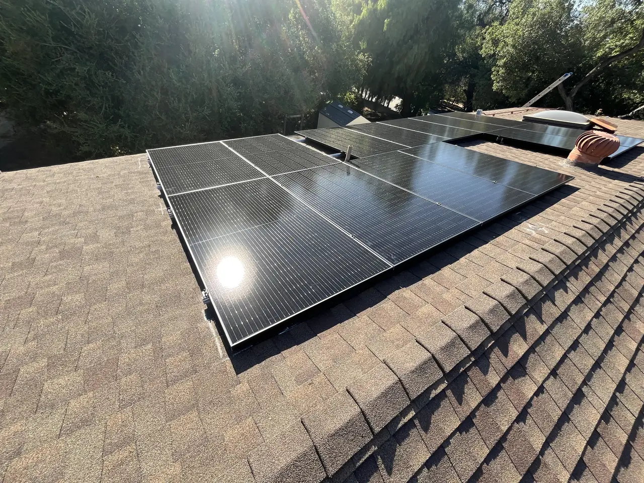 Solar panel mounting detail on a composition shingle roof in Simi Valley, CA