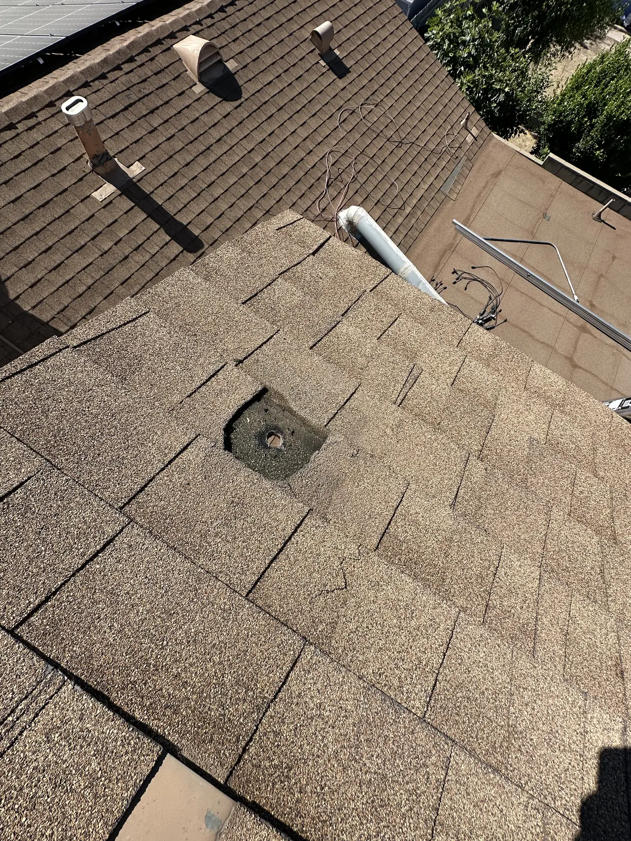 Sealed attachment point on the older shingle of a Simi Valley roof