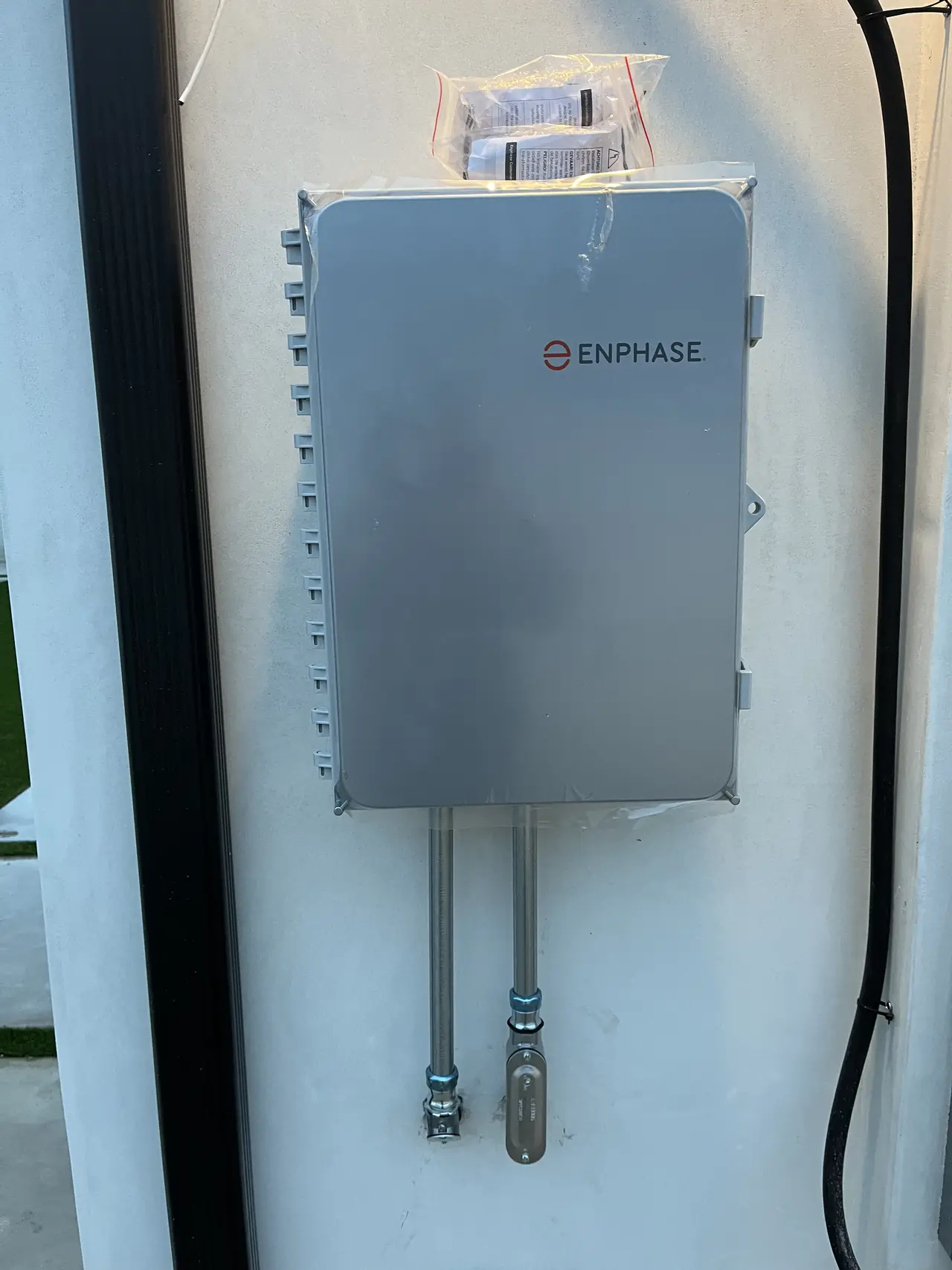 Enphase gateway mounted on an exterior wall, Sun Valley
