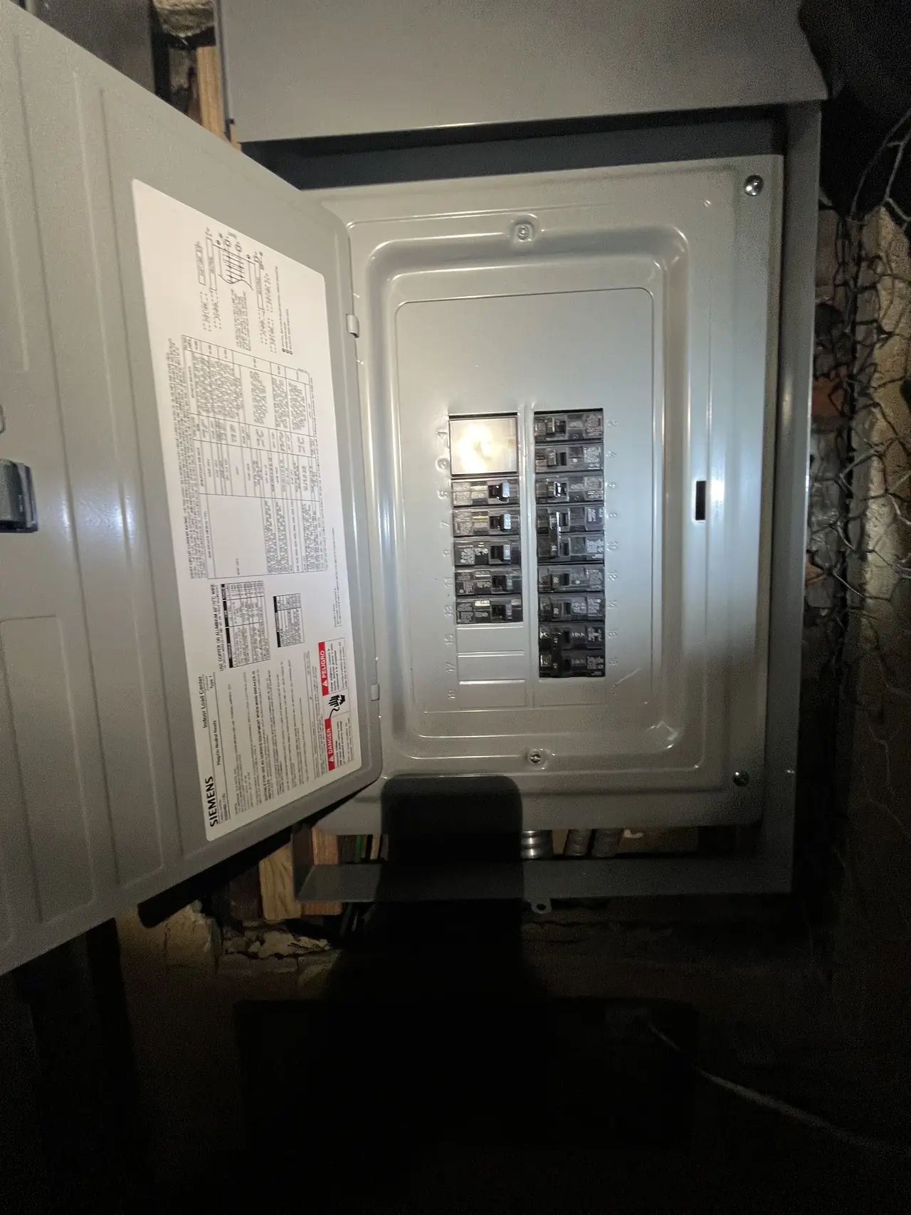 A new Siemens electrical panel with its door open and the inner cover in place, Sunland