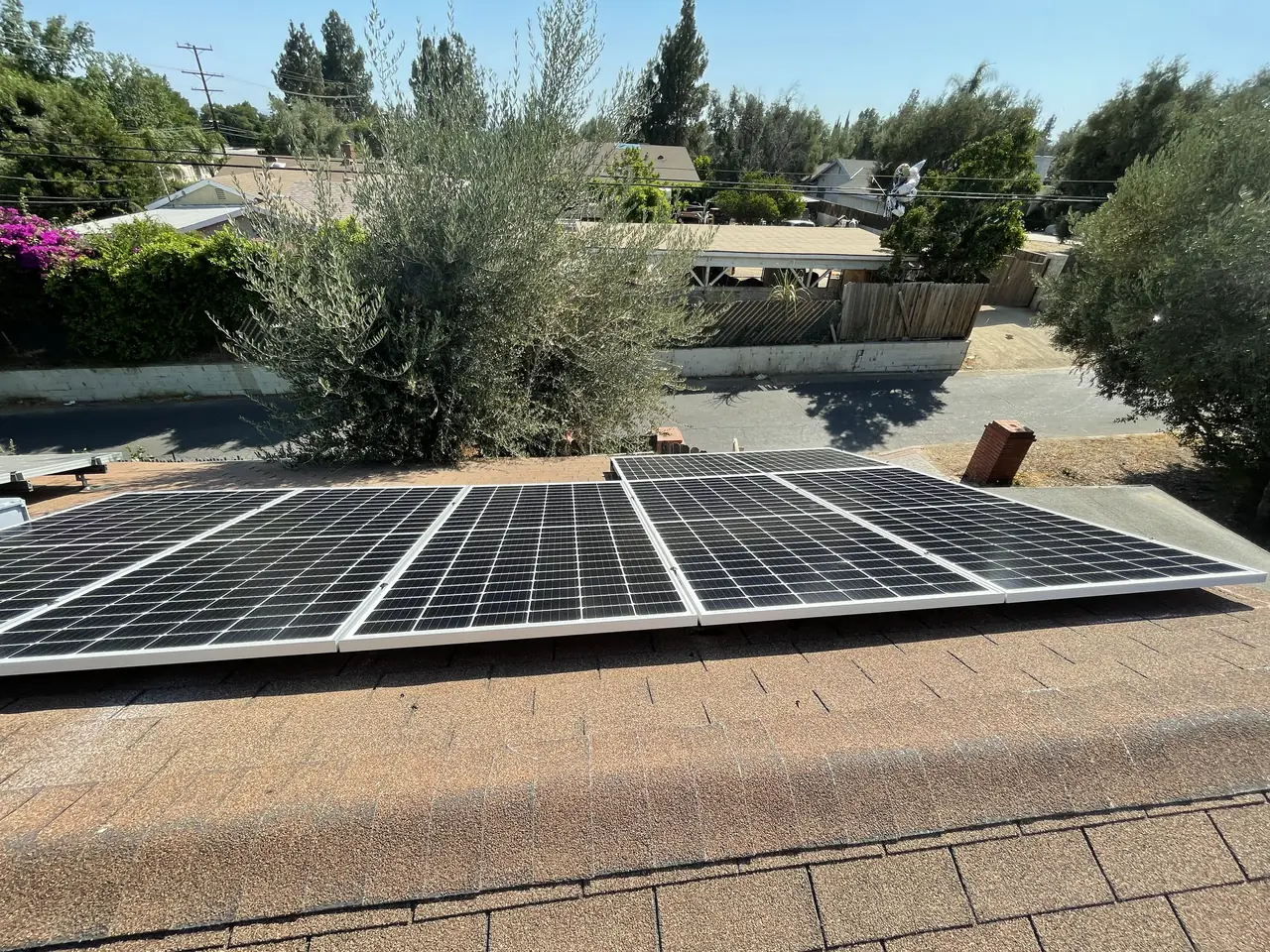 Solar panel mounting detail on a composition shingle roof in Sylmar, CA