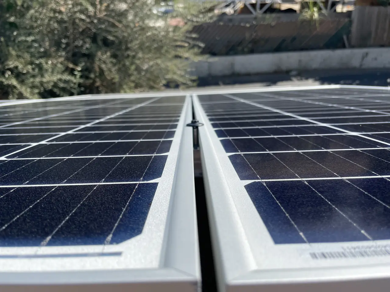 Two rows of solar modules meeting at a roof ridge, Sylmar