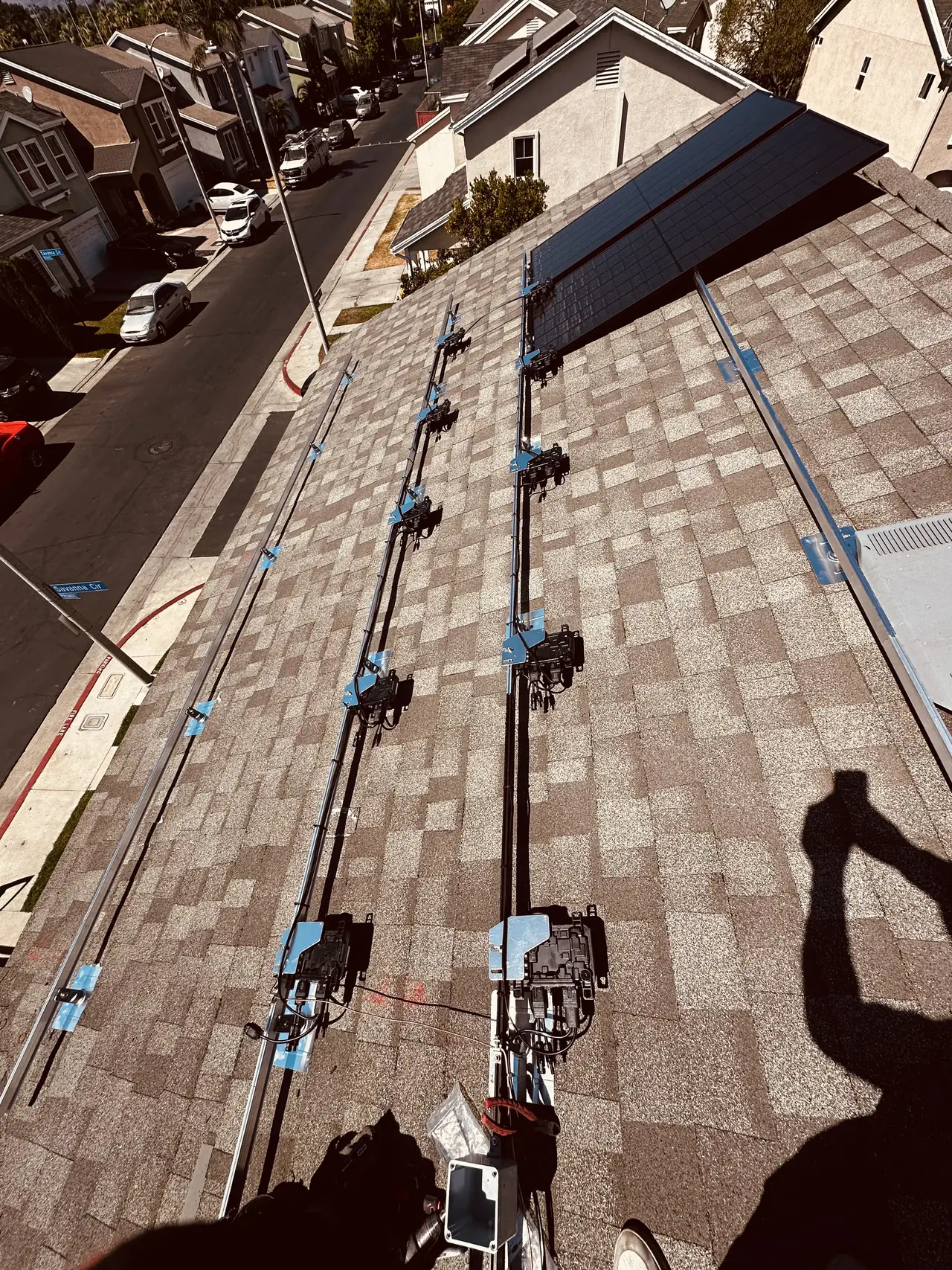 Racking rails installed across a composition shingle roof, Sylmar