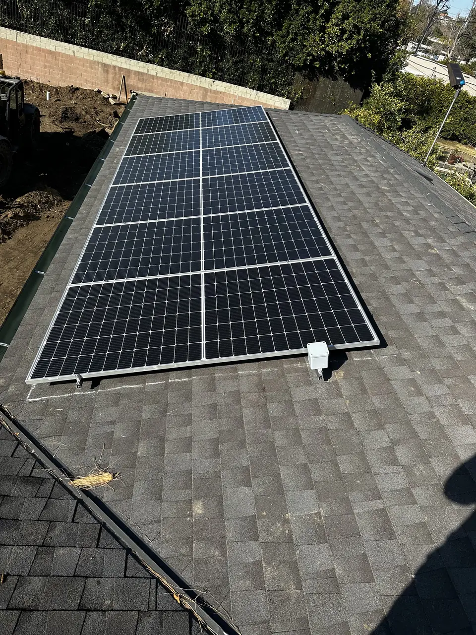 Solar panel mounting detail on a composition shingle roof in Tarzana, CA