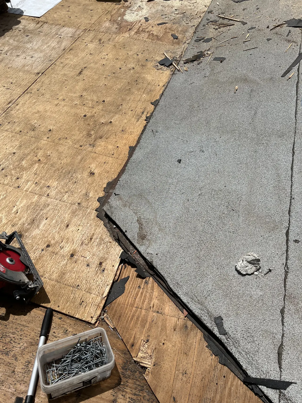 Old built-up roofing stripped back to bare plywood during the tear-off, Tarzana