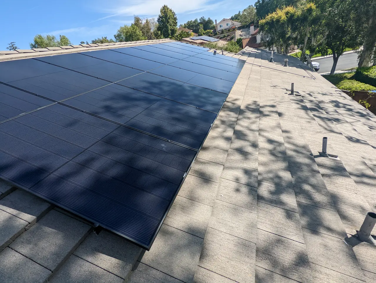 Solar panel mounting detail on a composition shingle roof in Thousand Oaks, CA