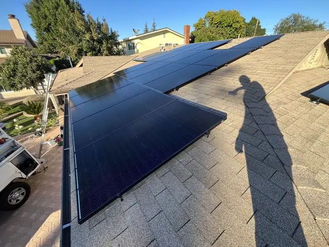 Solar panel mounting detail on a composition shingle roof in Van Nuys, CA