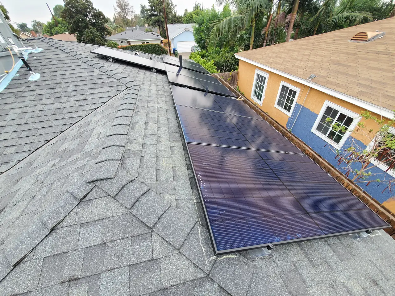 Solar panel mounting detail on a composition shingle roof in Van Nuys, CA