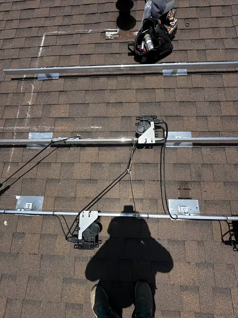 Solar panel mounting detail on a composition shingle roof in Van Nuys, CA