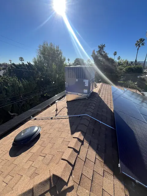 Solar panel mounting detail on a composition shingle roof in Van Nuys, CA